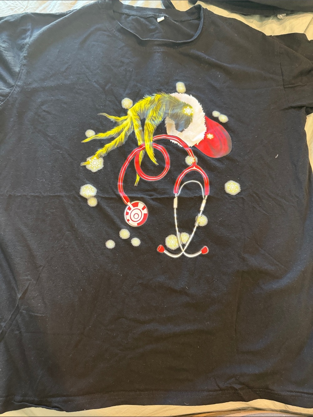 Amazon Black Tee with Red Stethoscope and Yellow Feather Graphic